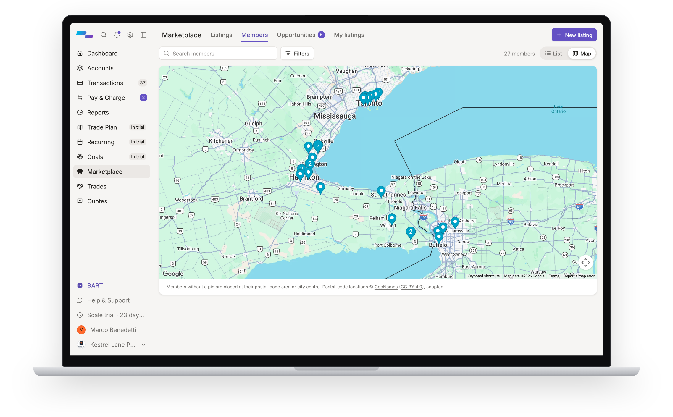 The BarterMax web app on a laptop: the member directory as a map of businesses around Lake Ontario.